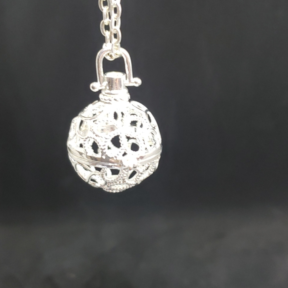 Silvertone floral cage pendant